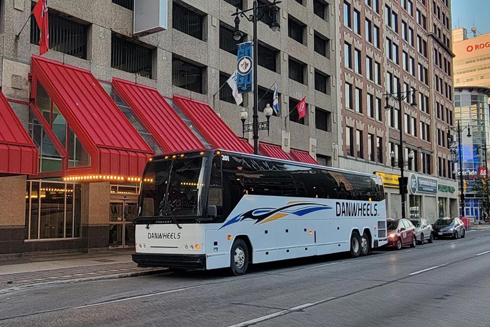 Danwheels Charter Bus Parked Outside a Hotel On A Ballgame Road Trip to Take People to the Ballpark